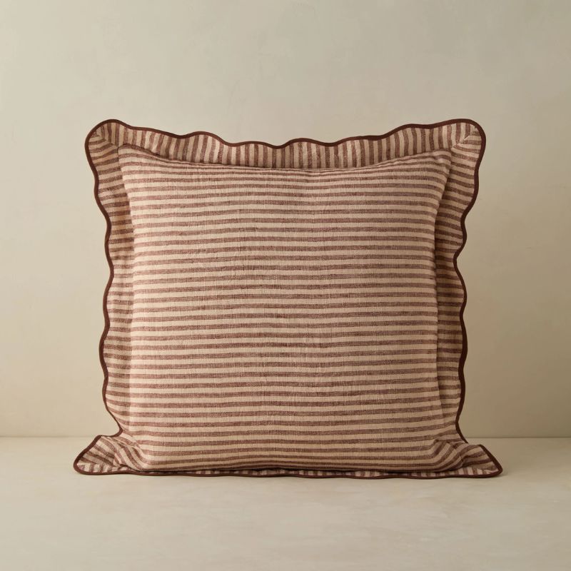 red and cream striped cushion with wavy edge