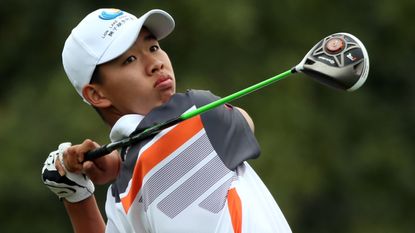 Guan Tianlang takes a shot during the 2013 Masters