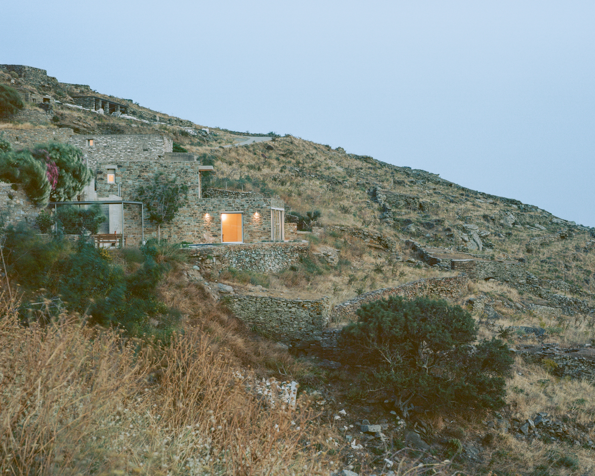 view of a Tinos house, using local vernacular such as stone walls and contemporary design