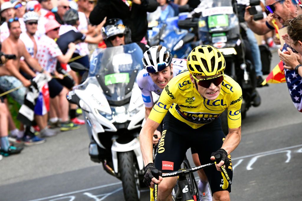 MORZINE LES PORTES DU SOLEIL FRANCE JULY 15 LR Tadej Pogacar of Slovenia and UAE Team Emirates White best young jersey and Jonas Vingegaard of Denmark and Team JumboVisma Yellow leader jersey compete in the breakaway while fans cheers during the stage fourteen of the 110th Tour de France 2023 a 1518km stage from Annemasse to Morzine les Portes du Soleil UCIWT on July 15 2023 in Morzine les Portes du Soleil France Photo by Bernard Papon PoolGetty Images