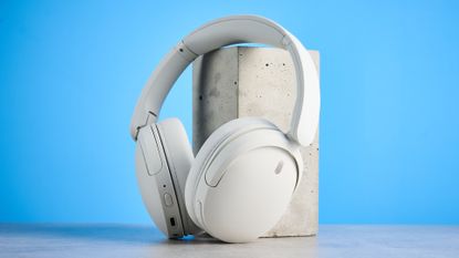 Sony WH-CH730N in white photographed in front of a blue background