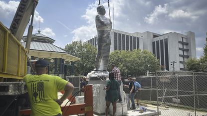 A large bronze statue of the late civil rights leader and politician Congressman John Lewis is installed where a monument to the Confederacy was brought down in 2020,