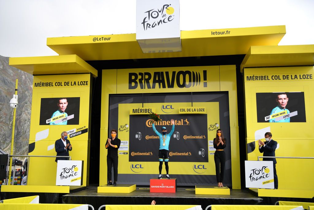 MERIBEL FRANCE SEPTEMBER 16 Podium Miguel Angel Lopez Moreno of Colombia and Astana Pro Team Celebration Emmanuel Macron President of France Medal Flowers Mask Covid safety measures Miss Hostess during the 107th Tour de France 2020 Stage 17 a 170km stage from Grenoble to Mribel Col de la Loze 2304m TDF2020 LeTour on September 16 2020 in Mribel France Photo by Stuart FranklinGetty Images