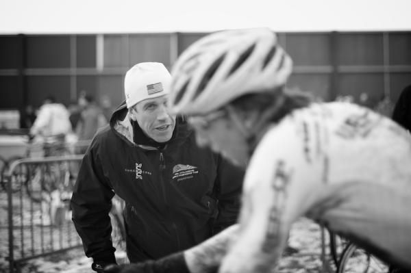ECXC Director Geoff Proctor yells encouragement to Cypress Gorry from the pits at Loenhout