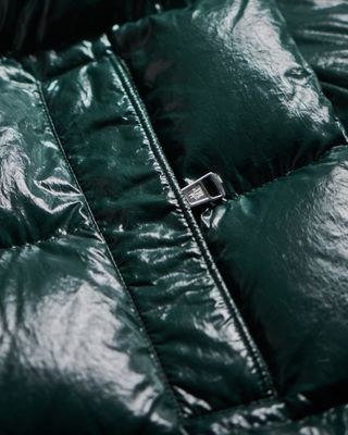 Close up of zip of Moncler Maya puffer jacket