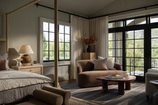 A bedroom with dry flower arrangement in the corner