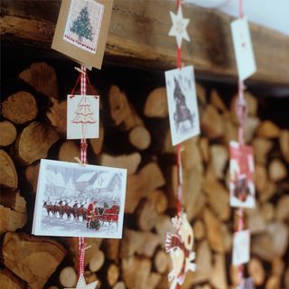 firewood with hanging cards and ribbon