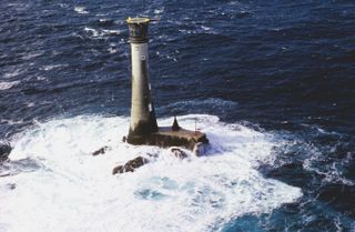 Wolfrock Lighthouse in rough seas, one of our picks for the best UK lighthouses