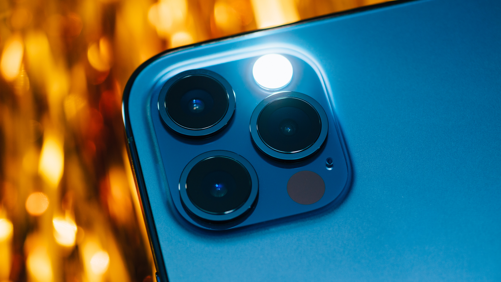 iPhone 13 Pro camera array with LED flash activated demonstrating a hidden iPhone feature