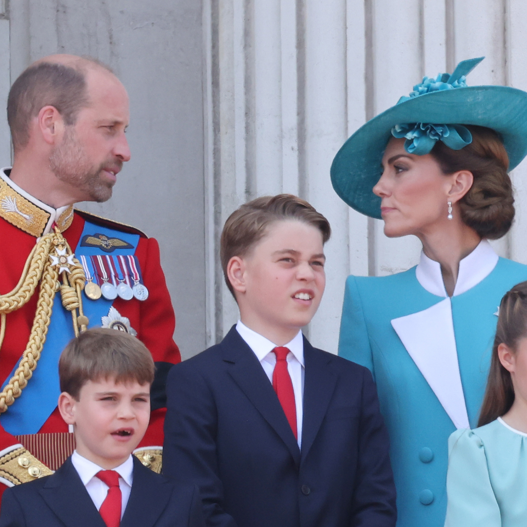 Kate Middleton and Prince William talking on the Buckingham Palace balcony at Trooping the Colour