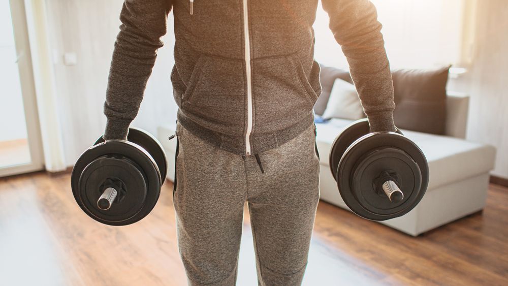 Man holding dumbbells