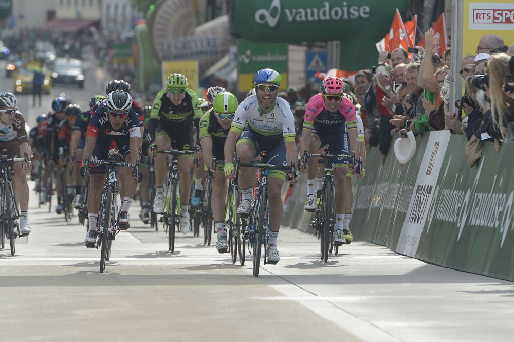 Michael Albasini crosses the line for the stage win.