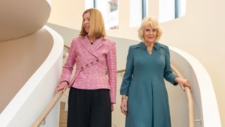 Queen Camilla arrives with Dame Laura Lee, Maggie's Chief Executive, during her visit to Maggie's new cancer support centre