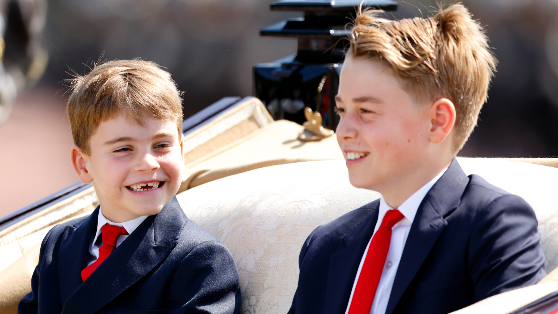 Prince George and Prince Louis climbing rocks