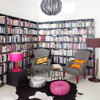 book shelves with soft leather chairs