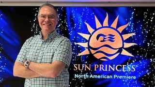 SCN's Mark J. Pescatore in front of LG display on Princess Sun