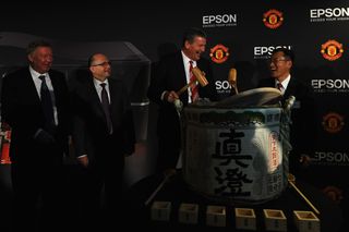 Sir Alex Ferguson looks on as Epson and Manchester United seal the deal with a ceremonial sake ritual