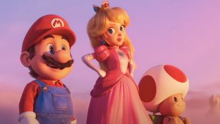 Mario, Peach, and Toad stand among pink fluffy clouds in The Super Mario Bros Movie.