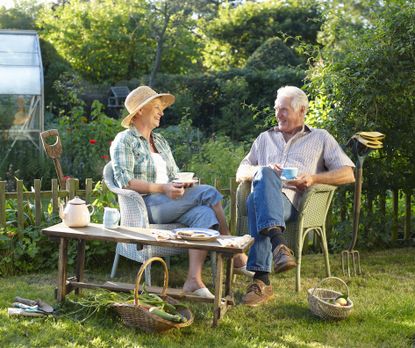 Senior couple sitting in garden