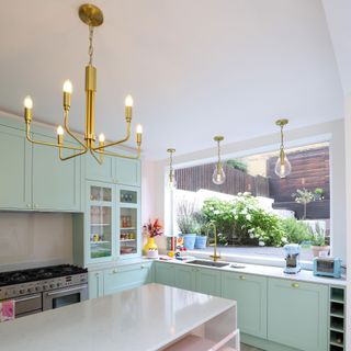 kitchen with pendant light and cabinet