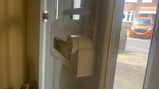 Ultion Nuki smart lock installed on a front door
