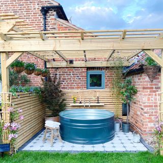 Dip tank on tiled patio area in back garden