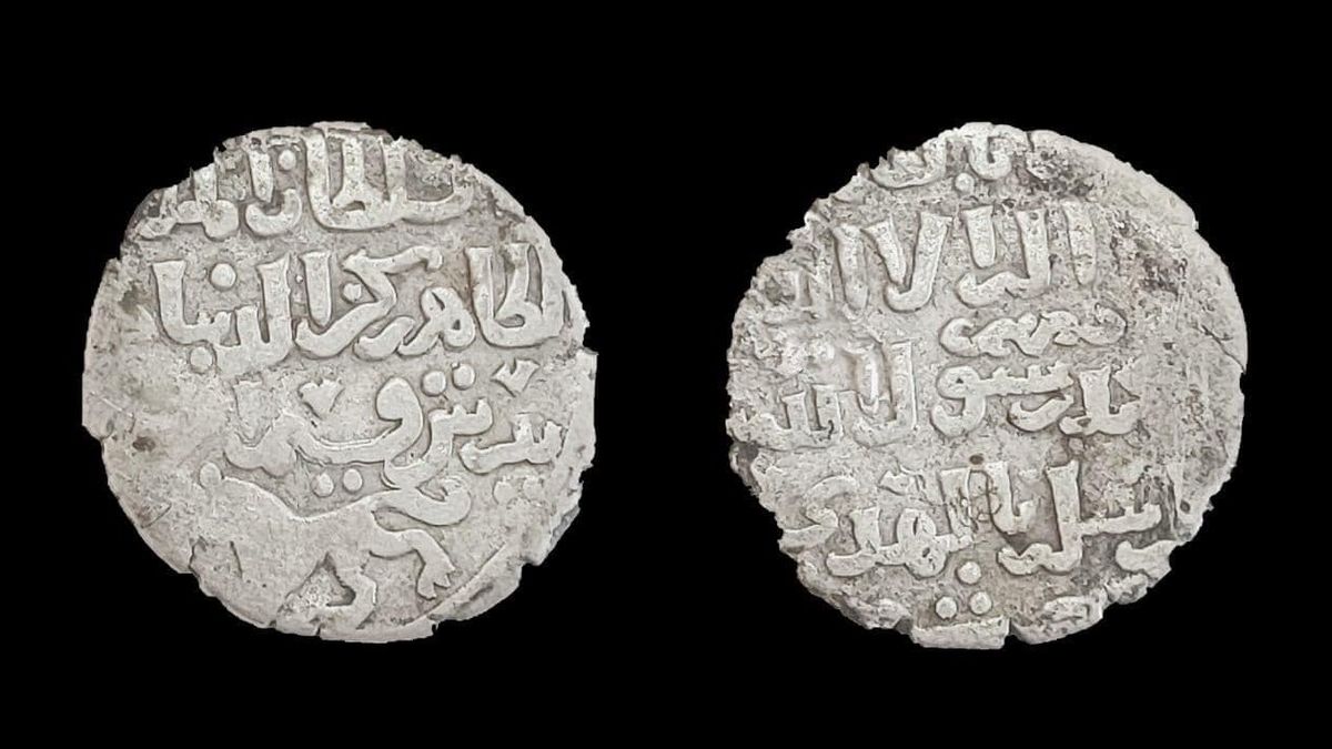 Two silver coins from the Islamic era found behind a temple in Egypt.