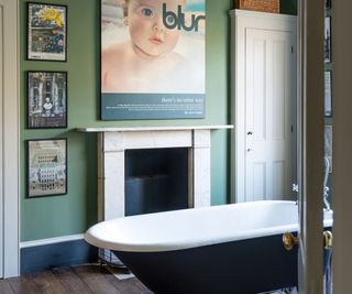 bathroom painted in Farrow & Ball Caulke Green with black rolltop bath