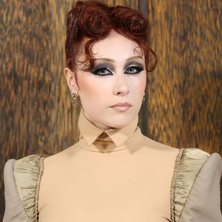 Chappell Roan attended the Mugler Fall 2026 in a nude two-tone skirt set