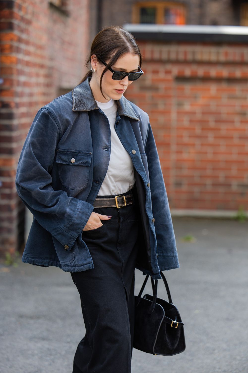street style shot of woman wearing a barn jacket