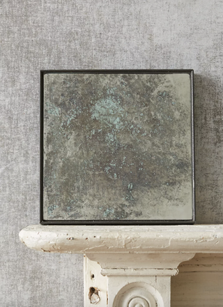 Color-washed antique statement wall mirror from Anthropologie.