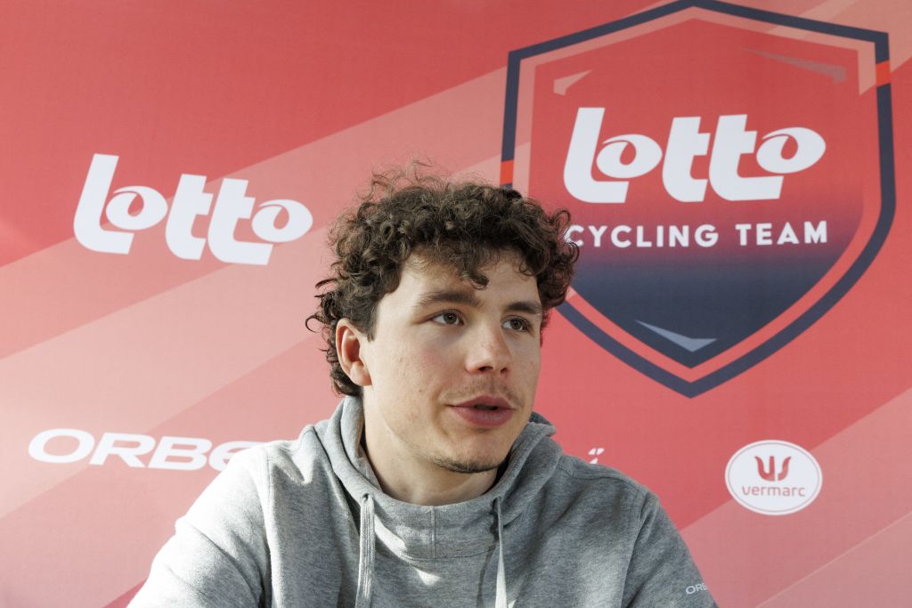 Belgian Arnaud De Lie of Lotto Cycling Team speaks during a press conference of Lotto Cycling Team, Friday 28 February 2025, in Sint-Martens-Latem, ahead of this weekend's one-day cycling race Omloop Het Nieuwsblad, opening race of the Flemish classic one day races season. (Photo by NICOLAS MAETERLINCK / Belga / AFP) / Belgium OUT