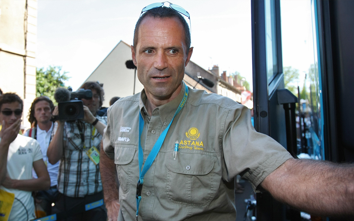 Semur-en-Auxois, FRANCE: Astana's team manager Germany's Mario Kummer stands by his bus before the sixth stage of the 94th Tour de France (Photo credit should read FRANCK FIFE/AFP via Getty Images)