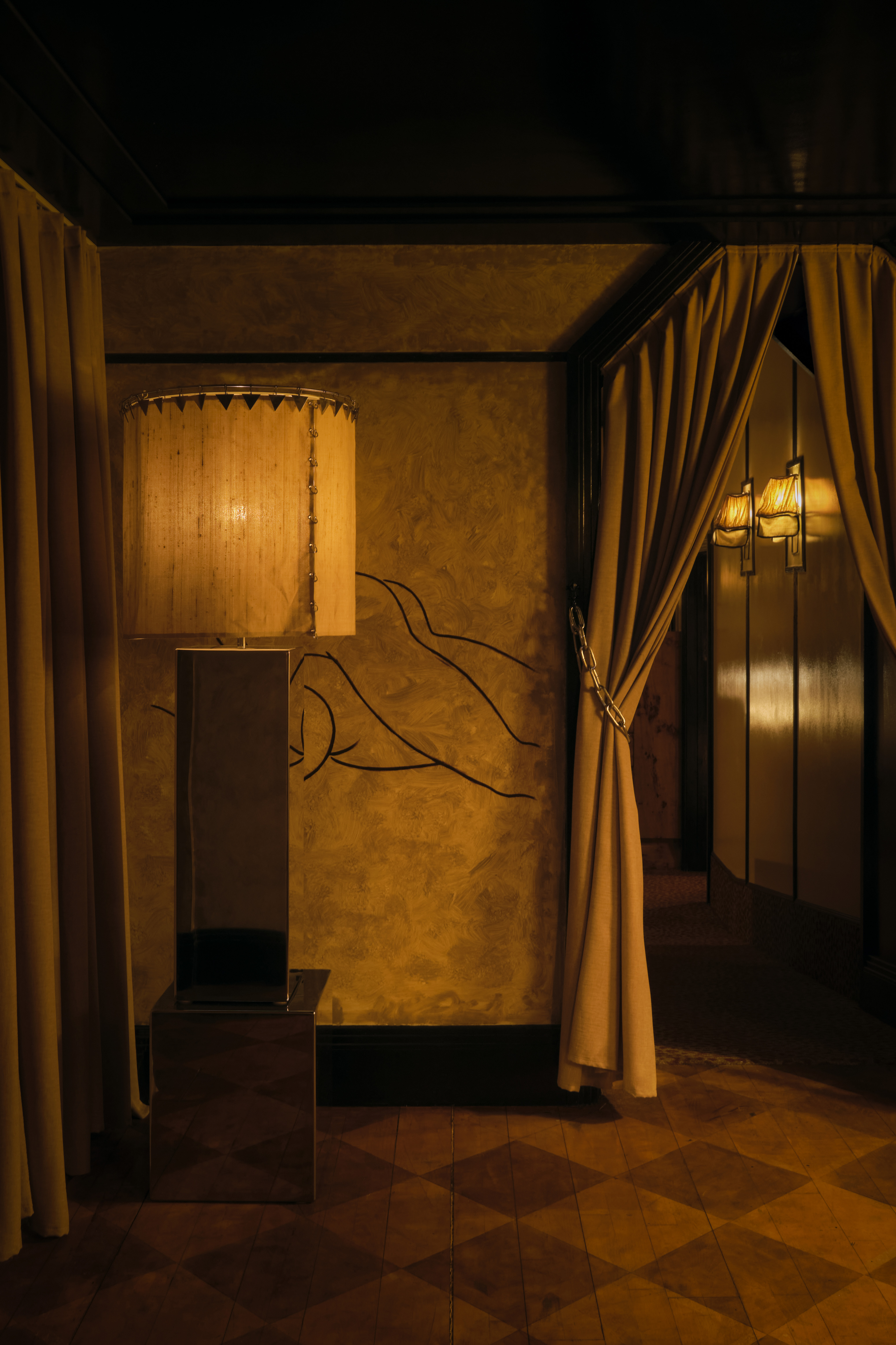 A golden-hued, dimly lit nightclub features velvety red or ochre plush fabrics, reflective surfaces, Art Deco-inspired sconces, and an air of mystery.