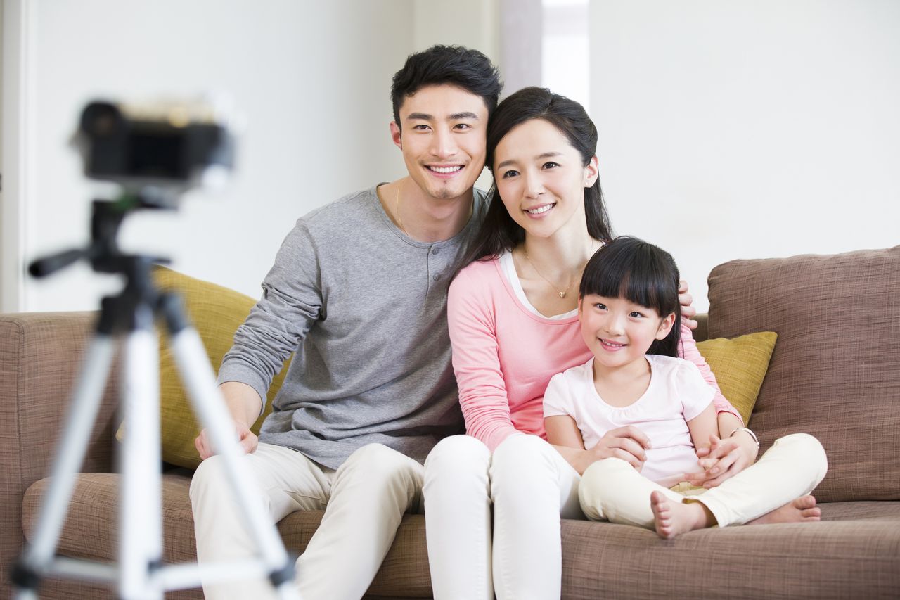 family taking photo with a tripod