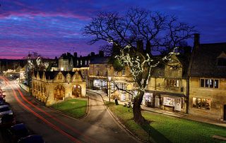 Market Hall and Cotswold stone cottages along High Street at dusk, Chipping Campden, Cotswolds, Gloucestershire