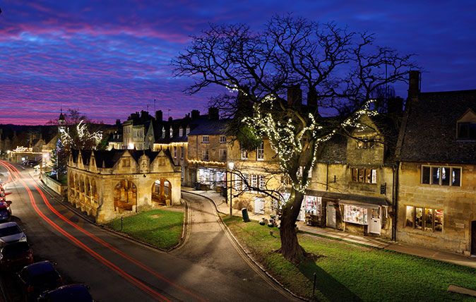 Market Hall and Cotswold stone cottages along High Street at dusk, Chipping Campden, Cotswolds, Gloucestershire