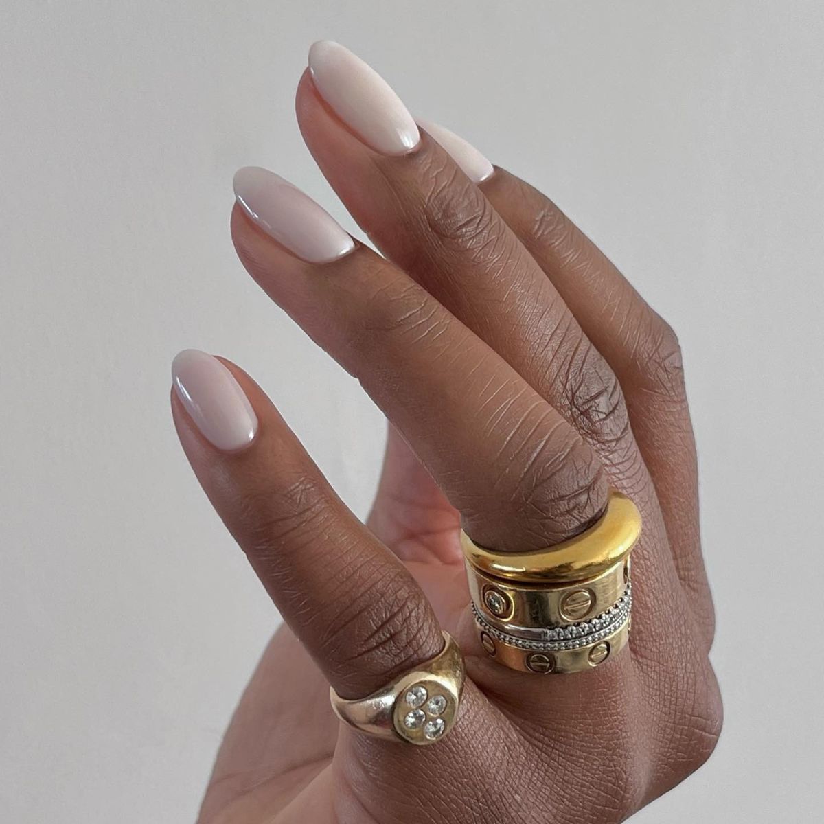 An image of a soft white manicure.