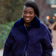 nikki ogunnaike wearing blue coat