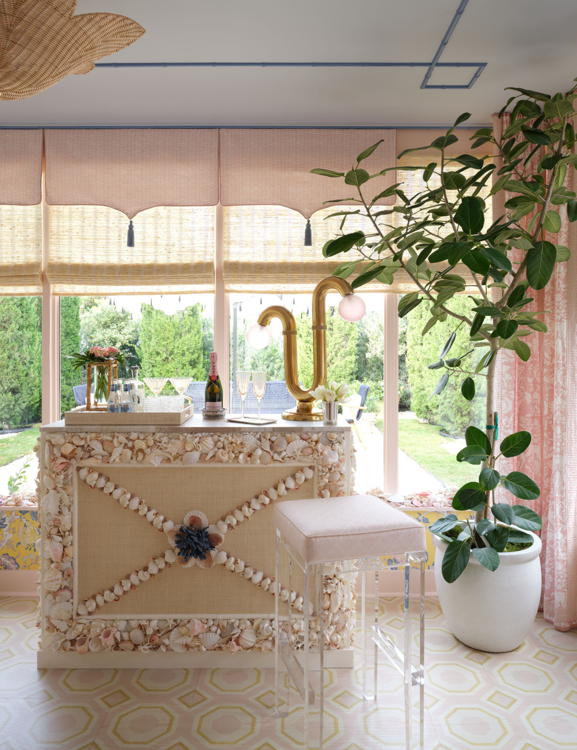 Seashell-accented bar overlooking a scenic pool area