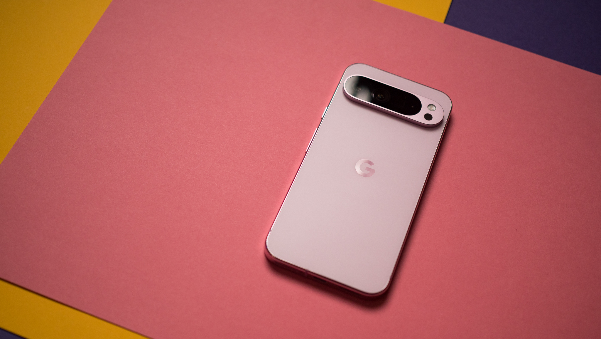 Pixel 9 Pro XL back view against colorful background