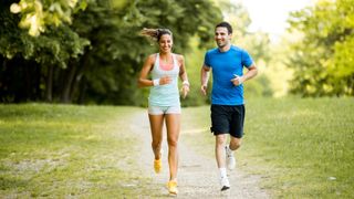 Running workout with man and woman on a trail