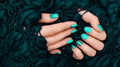 nails painted green with green background