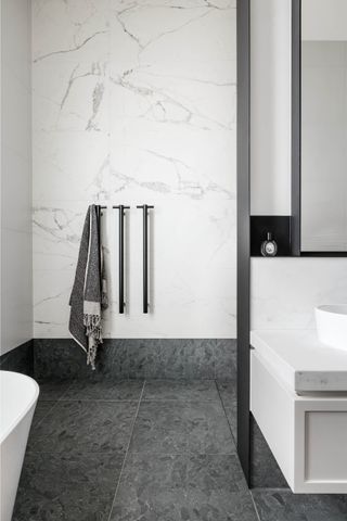 A bathroom with towel rail