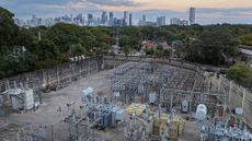 View of high voltage power lines running through a sub-station along the electrical power grid in Miami, Florida.