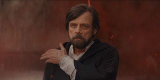 Luke Skywalker, brushing off dust in Star Wars: The Last Jedi