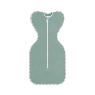 A pale green baby swaddling sleep bag