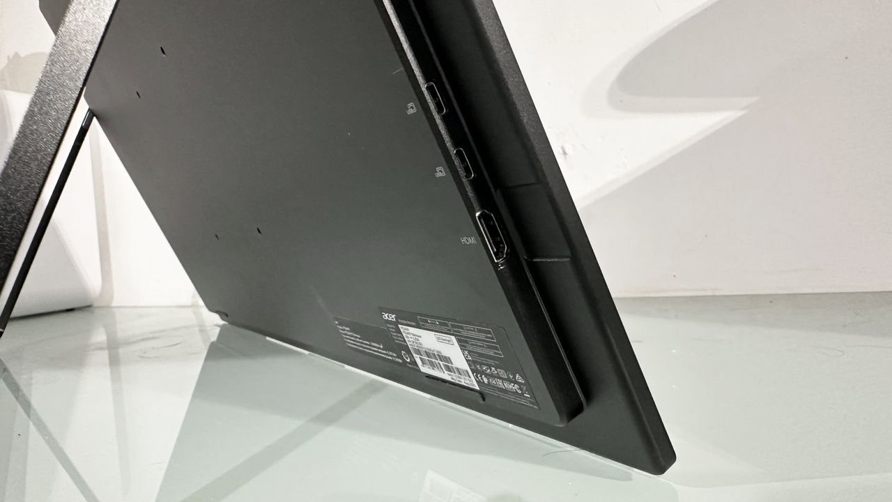 The Acer PD243Y E portable monitor in a home office during our testing