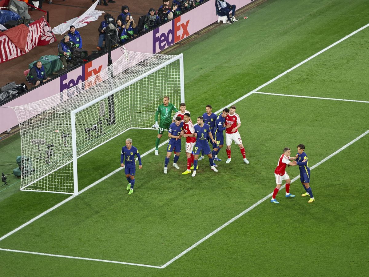 A Champions League soccer match between Arsenal and Atletico Madrid, as seen from the upper stand at the Emirates stadium, London. Zoomed in photos of the players