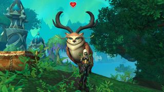 WoW our owlies - a blood elf demon hunter is standing in front of a Tawny Somnowl who has a red heart floating over their head